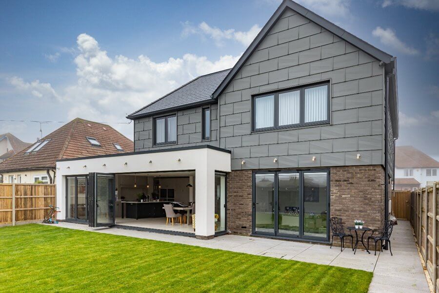 aluk BSF70 optio black bi folding doors on house