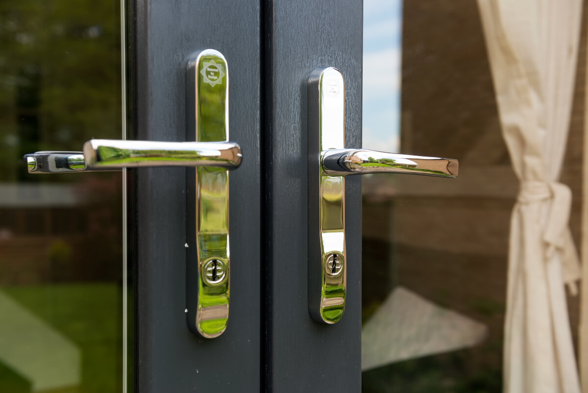 close up of chrome handles on modus french doors