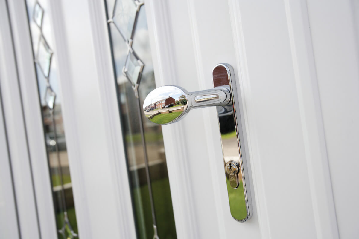 chrome handle on white upvc front door